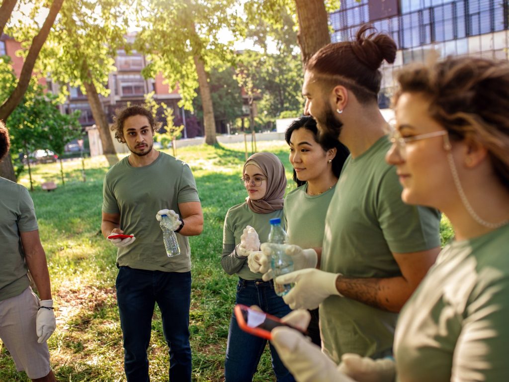 Volunteers collecting litter together in a city park